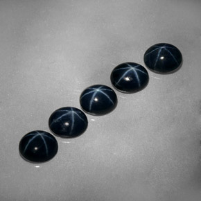Gemas de zafiro estrella azul natural de  ct, corte óvalo, opaco