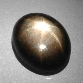 Zafiro estrella negro natural de 7,90 ct, corte óvalo, opaco