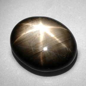 Zafiro estrella negro natural de 10,83 ct, corte óvalo, opaco