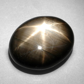 Zafiro estrella negro natural de 10,83 ct, corte óvalo, opaco