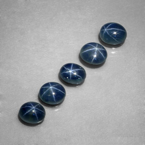 Gemas de zafiro estrella azul natural de  ct, corte óvalo, translúcido