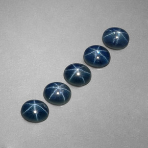 Gemas de zafiro estrella azul natural de  ct, corte óvalo, translúcido