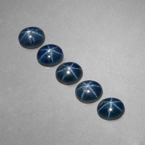 Gemas de zafiro estrella azul natural de  ct, corte óvalo, translúcido