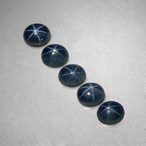 Gemas de zafiro estrella azul natural de  ct, corte óvalo, translúcido