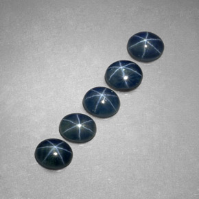 Gemas de zafiro estrella azul natural de  ct, corte óvalo, translúcido