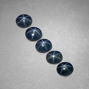 Gemas de zafiro estrella azul natural de  ct, corte óvalo, translúcido