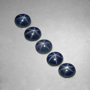 Gemas de zafiro estrella azul natural de  ct, corte óvalo, translúcido