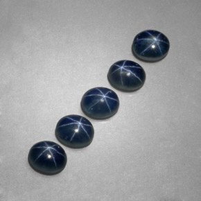 Gemas de zafiro estrella azul natural de  ct, corte óvalo, translúcido