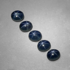 Gemas de zafiro estrella azul natural de  ct, corte óvalo, translúcido