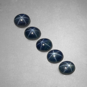 Gemas de zafiro estrella azul natural de  ct, corte óvalo, translúcido