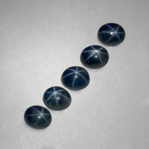 Gemas de zafiro estrella azul natural de  ct, corte óvalo, translúcido