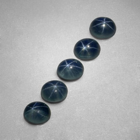 Gemas de zafiro estrella azul natural de  ct, corte óvalo, translúcido
