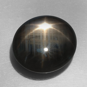 Zafiro estrella negro natural de 32,76 ct, corte óvalo, opaco