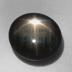 Zafiro estrella negro natural de 32,76 ct, corte óvalo, opaco