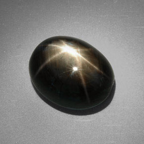 Zafiro estrella negro natural de 9,85 ct, corte óvalo, opaco