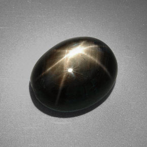 Zafiro estrella negro natural de 9,85 ct, corte óvalo, opaco