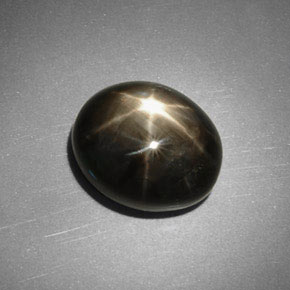 Zafiro estrella negro natural de 5,75 ct, corte óvalo, opaco