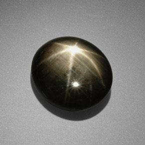 Zafiro estrella negro natural de 9,85 ct, corte óvalo, opaco
