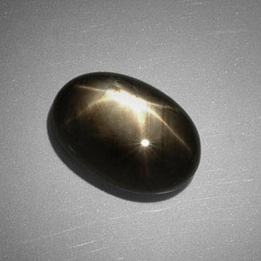 Zafiro estrella negro natural de 7,83 ct, corte óvalo, opaco