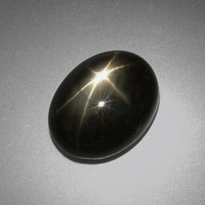 Zafiro estrella negro natural de 9,38 ct, corte óvalo, opaco