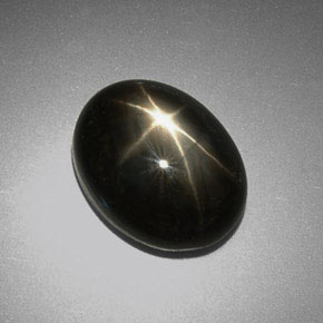 Zafiro estrella negro natural de 9,38 ct, corte óvalo, opaco