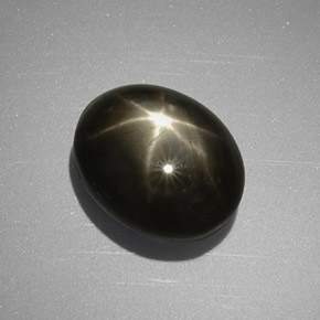 Zafiro estrella negro natural de 5,63 ct, corte óvalo, opaco