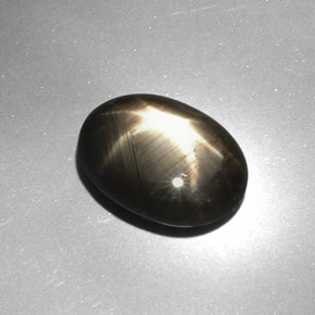 Zafiro estrella negro natural de 7,08 ct, corte óvalo, opaco