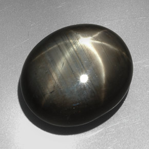 Zafiro estrella negro natural de 27,29 ct, corte óvalo, opaco