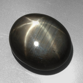 Zafiro estrella negro natural de 27,29 ct, corte óvalo, opaco
