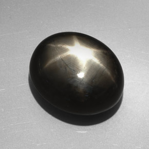 Zafiro estrella negro natural de 27,17 ct, corte óvalo, opaco