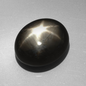 Zafiro estrella negro natural de 27,17 ct, corte óvalo, opaco
