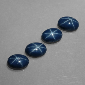 Gemas de zafiro estrella azul natural de  ct, corte óvalo, opaco