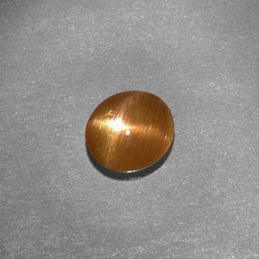 Piedra sol estrella marrón natural de 0,79 ct, corte óvalo, opaco