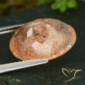Piedrasol Naranja claro natural de 5.89 ct, Ovalada, Translúcido