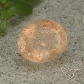 Piedrasol Naranja durazno claro natural de 4.98 ct, Ovalada, Translúcido