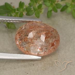 Piedrasol Naranja claro medio natural de 4.87 ct, Ovalada, Translúcido