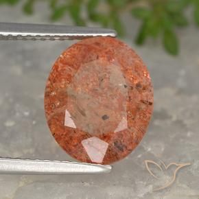 Piedrasol Naranja rojizo natural de 4.24 ct, Ovalada, Translúcido