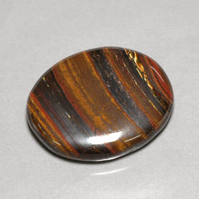 Tiger's eye matrix multicolor natural de 53,09 ct, corte óvalo, opaco