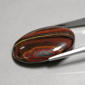 Tiger's eye matrix multicolor natural de 45,58 ct, corte óvalo, opaco
