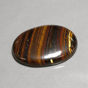 Tiger's eye matrix multicolor natural de 43,53 ct, corte óvalo, opaco