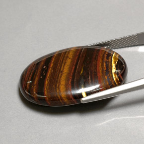 Tiger's eye matrix multicolor natural de 43,53 ct, corte óvalo, opaco