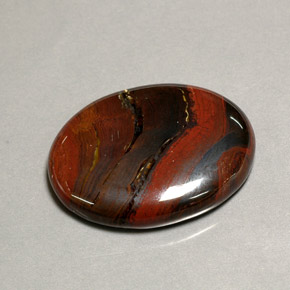 Tiger's eye matrix multicolor natural de 41,60 ct, corte óvalo, opaco