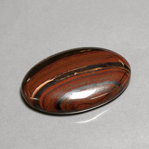 Tiger's eye matrix multicolor natural de 35,01 ct, corte óvalo, opaco