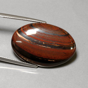 Tiger's eye matrix multicolor natural de 35,01 ct, corte óvalo, opaco