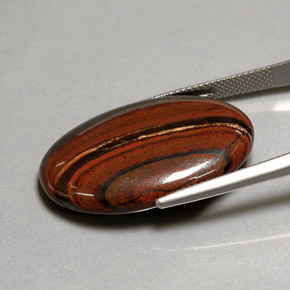 Tiger's eye matrix multicolor natural de 35,01 ct, corte óvalo, opaco
