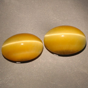 Gemas de tiger's eye amarillo natural de  ct, corte óvalo, opaco