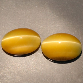Gemas de tiger's eye amarillo natural de  ct, corte óvalo, opaco