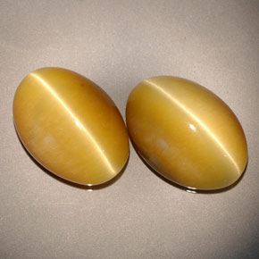 Gemas de tiger's eye amarillo natural de  ct, corte óvalo, opaco
