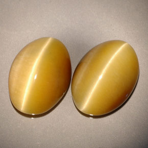 Gemas de tiger's eye amarillo natural de  ct, corte óvalo, opaco