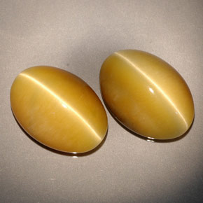 Gemas de tiger's eye amarillo natural de  ct, corte óvalo, opaco